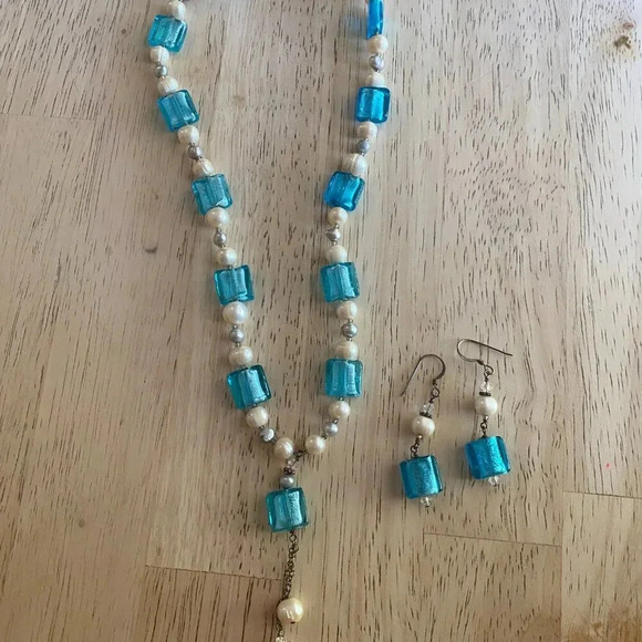 This necklace and earring set features aqua blue molded glass beads and a pearl— - Picture 2 of 5